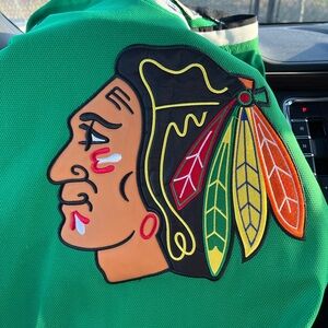 Green black hawks hockey jersey with Native American Logo. Sweet jersey